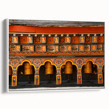 Vintage poster art of Bhutan scenery on extra-large framed canvas, featuring colorful art with black accents.