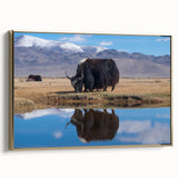 Framed canvas featuring a vintage-style landscape painting of Tibet with muted gold and black tones.