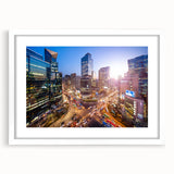 Abstract art print of Seoul skyline in muted gray and blue tones, framed with a white mat, suitable for dining room decor.