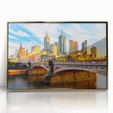 Mid-century modernist art of Melbourne skyline in gold and black tones on framed acrylic, ideal for modern art wall decor.