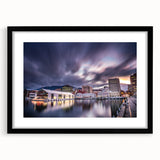 Extra large abstract art print of a colorful Tasmanian landscape on textured canvas, framed in black.