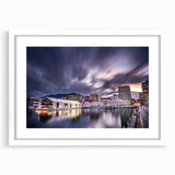 Textured abstract art print depicting Tasmania's landscape in muted earth tones on a framed white mat.