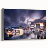 Framed canvas landscape painting of Tasmania, featuring muted earth tones and silver frame, suitable for bedroom decor.