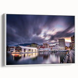 Framed canvas featuring a vintage-style landscape painting of Tasmania with colorful art elements on a black background.