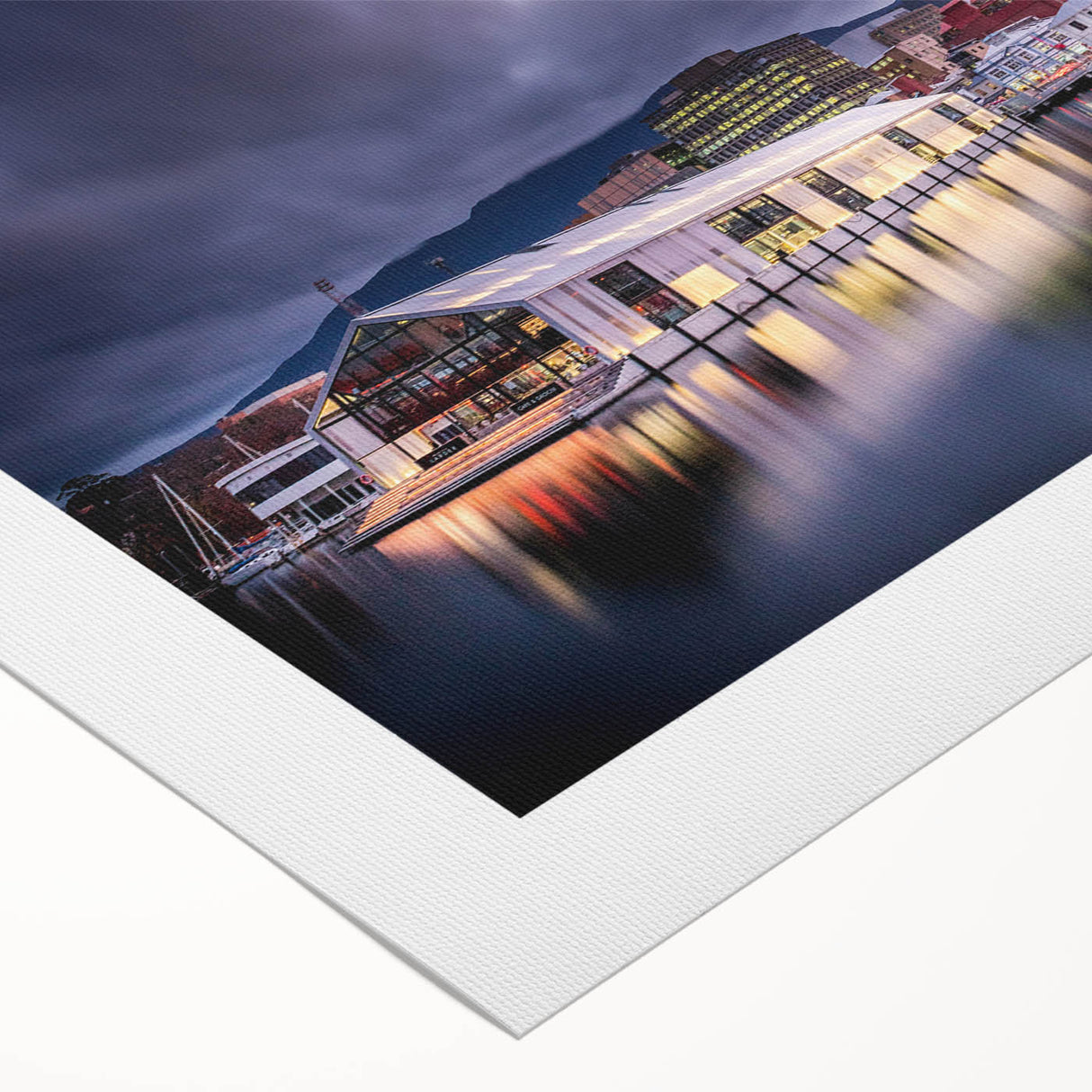 Art deco poster of Tasmania landscape in muted green and blue tones on rolled canvas, suitable for dining room decor.