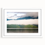 Abstract art print of British Columbia scenery in muted green and blue tones, framed with a white mat.
