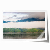 Scenic British Columbia landscape on rolled print, featuring lush greenery and mountains, in soft earth tones.