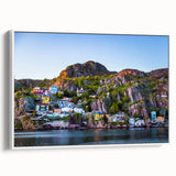 Vintage poster art of Newfoundland scenery on a large framed canvas, featuring vibrant colors, ideal for living room decor.