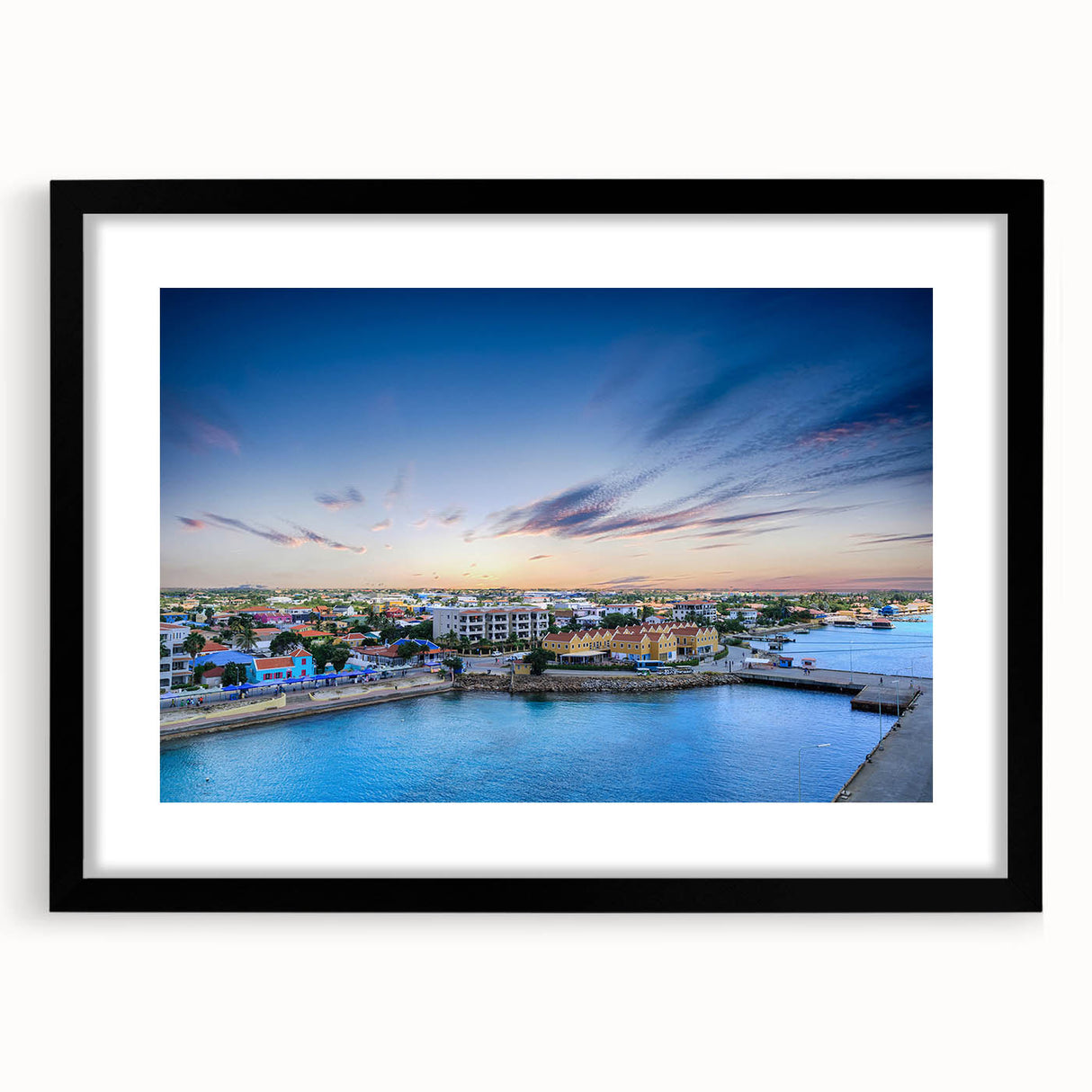 Extra large abstract art print of a colorful Caribbean scenery on textured canvas, framed in black.