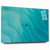 Large abstract wall art depicting Caribbean scenery in vibrant blue and green hues on acrylic glass.