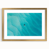 Abstract art print of Caribbean scenery in gold frame, featuring vibrant blue and green tones, ideal for dining room decor.