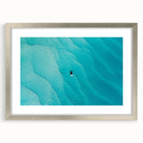 Extra large abstract art print of Caribbean scenery in silver frame, featuring textured blue and green hues.