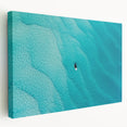 Large art of a Caribbean beach scene on stretched canvas, featuring turquoise waters and sandy shores.