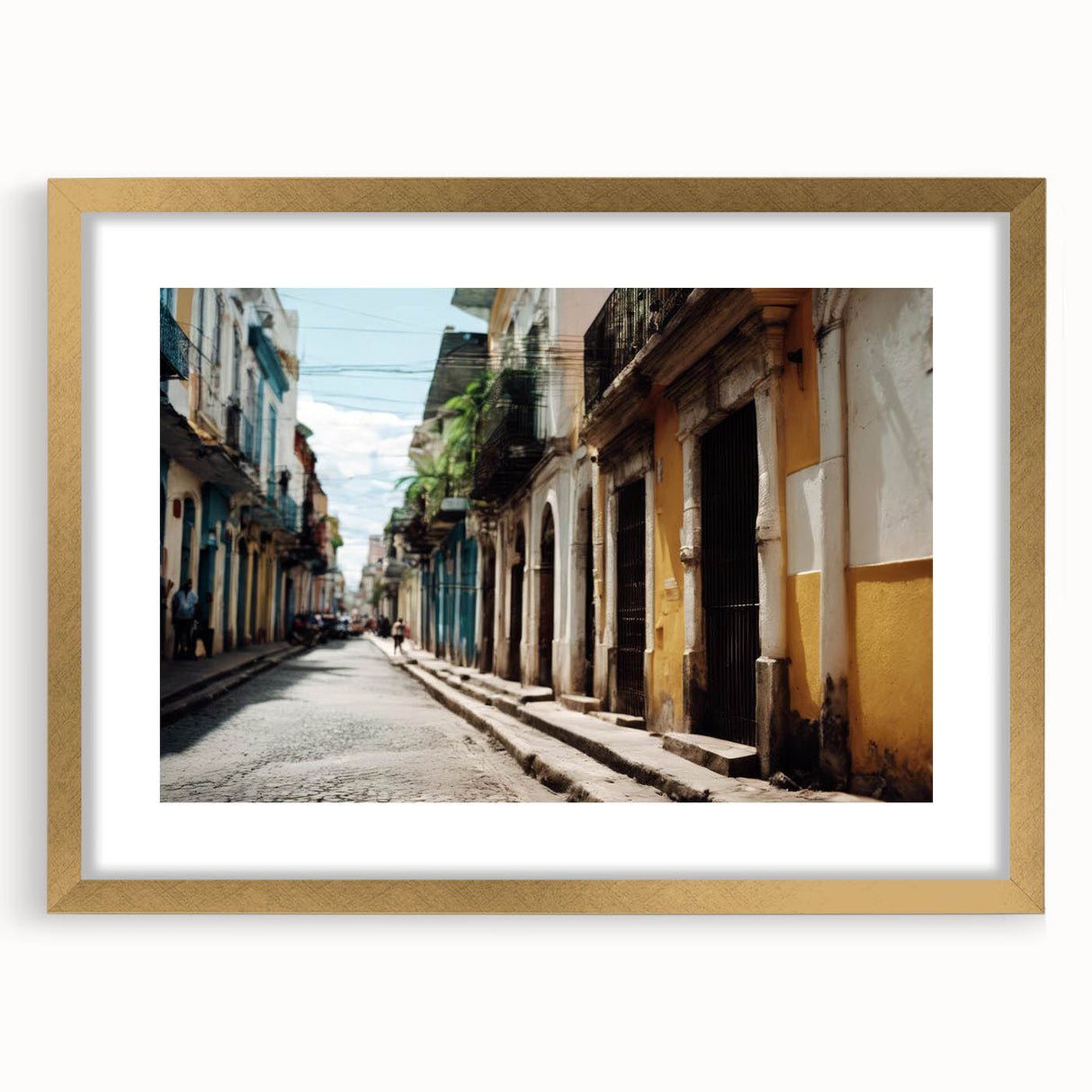 Abstract art print of a Caribbean scenery in muted blue and green tones, framed in gold.