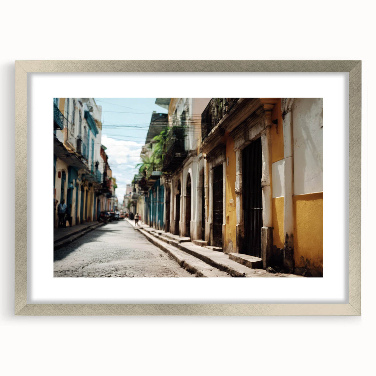 Extra large abstract art print depicting a Caribbean scenery in vibrant blue and green hues, framed with a silver mat.