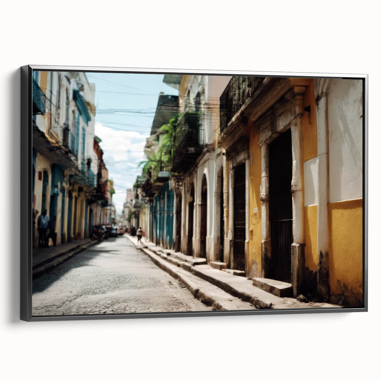 Black and white wall art featuring a vintage poster-style landscape of the Caribbean on framed canvas.