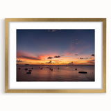 Abstract art print of a Caribbean seascape in muted blue and green tones, framed in gold, ideal for dining room decor.