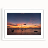 Textured abstract art print of Caribbean scenery in muted blue and green tones, framed with a white mat.