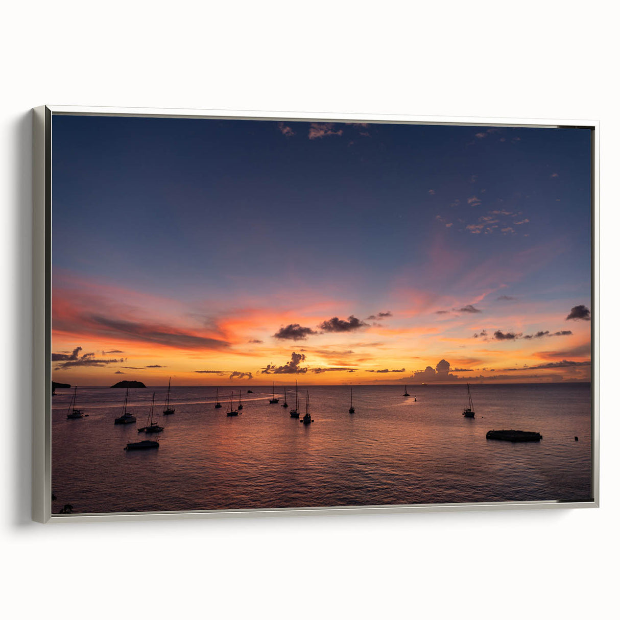 Framed canvas of a vintage-style landscape painting depicting the Caribbean coast, with vivid blue and green tones.