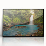 Large abstract wall art featuring a lush Costa Rican landscape in vibrant green and blue tones, framed in black acrylic.