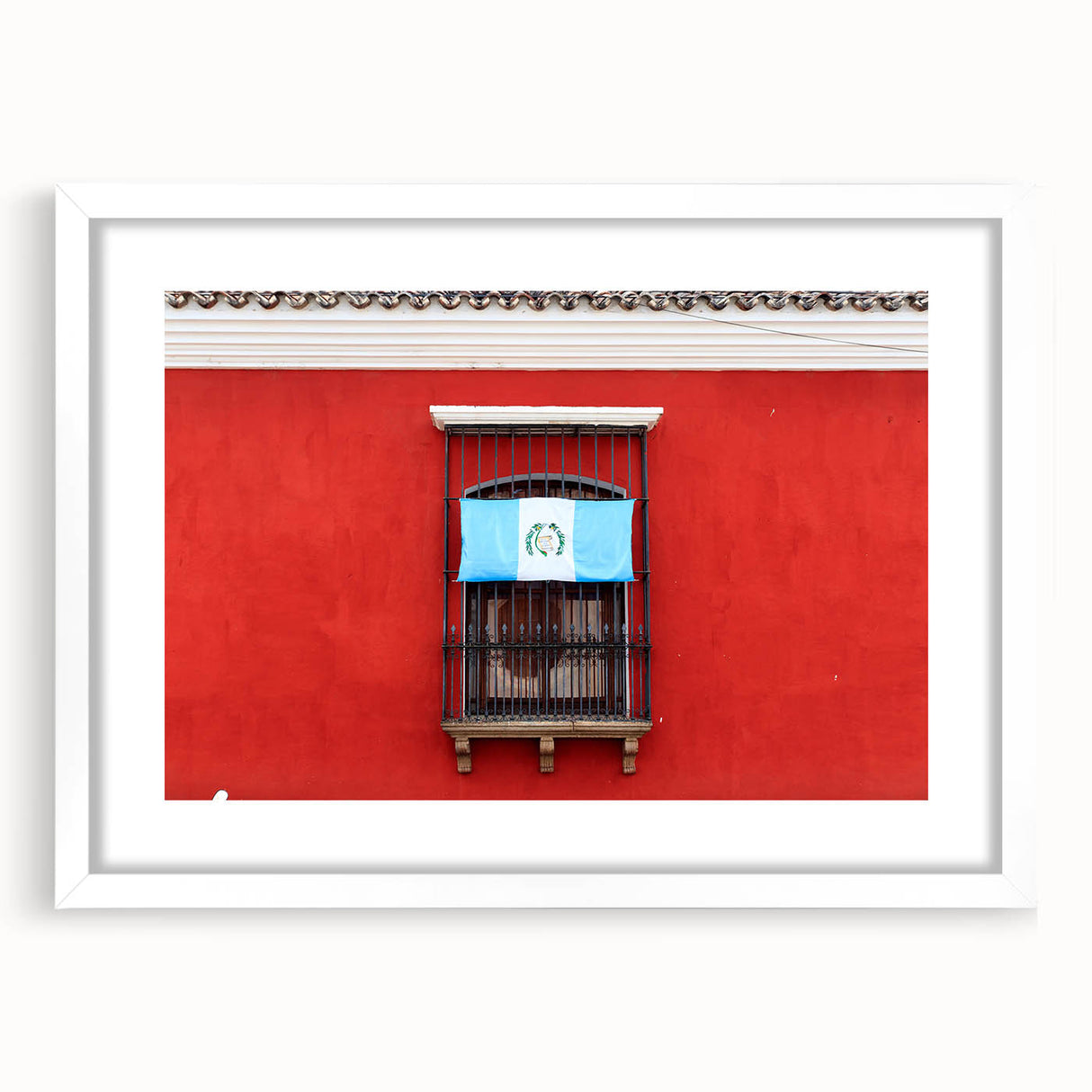 Abstract art print of a Central American landscape in muted earth tones, framed with a white mat.