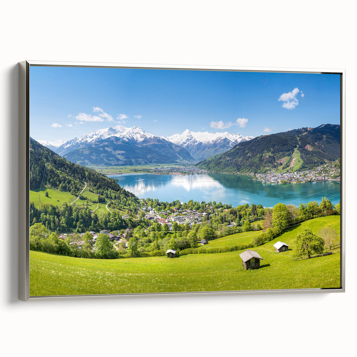 Framed canvas featuring a vintage-style landscape painting of an Austrian scenery in muted colors.