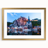 Abstract art print of a European scenery in muted earth tones, framed with a gold mat, suitable for dining room decor.