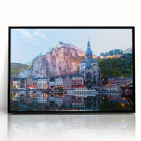 Large abstract wall art depicting a European scenery in muted earth tones, framed in black acrylic.