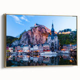 Framed canvas featuring a vintage-style landscape painting of a Belgian scenery in muted gold and black tones.