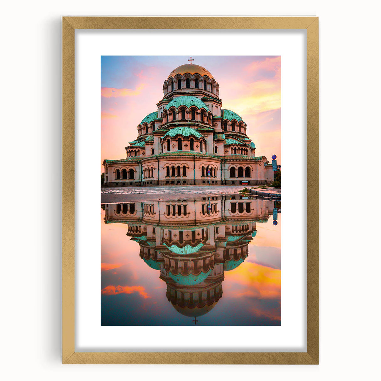Abstract art print of a European landscape in muted gold and green tones, framed with a gold mat.
