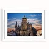 Textured art depicting an abstract Prague skyline in muted earth tones on a framed white mat, suitable for bedroom decor.