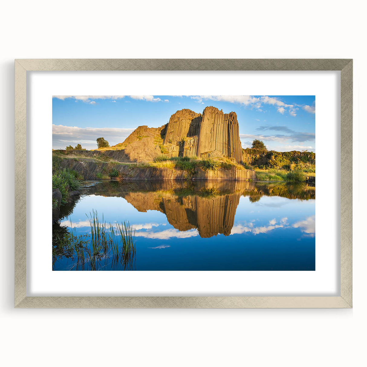 Extra large abstract art print depicting a textured European scenery in muted earth tones, framed in silver.