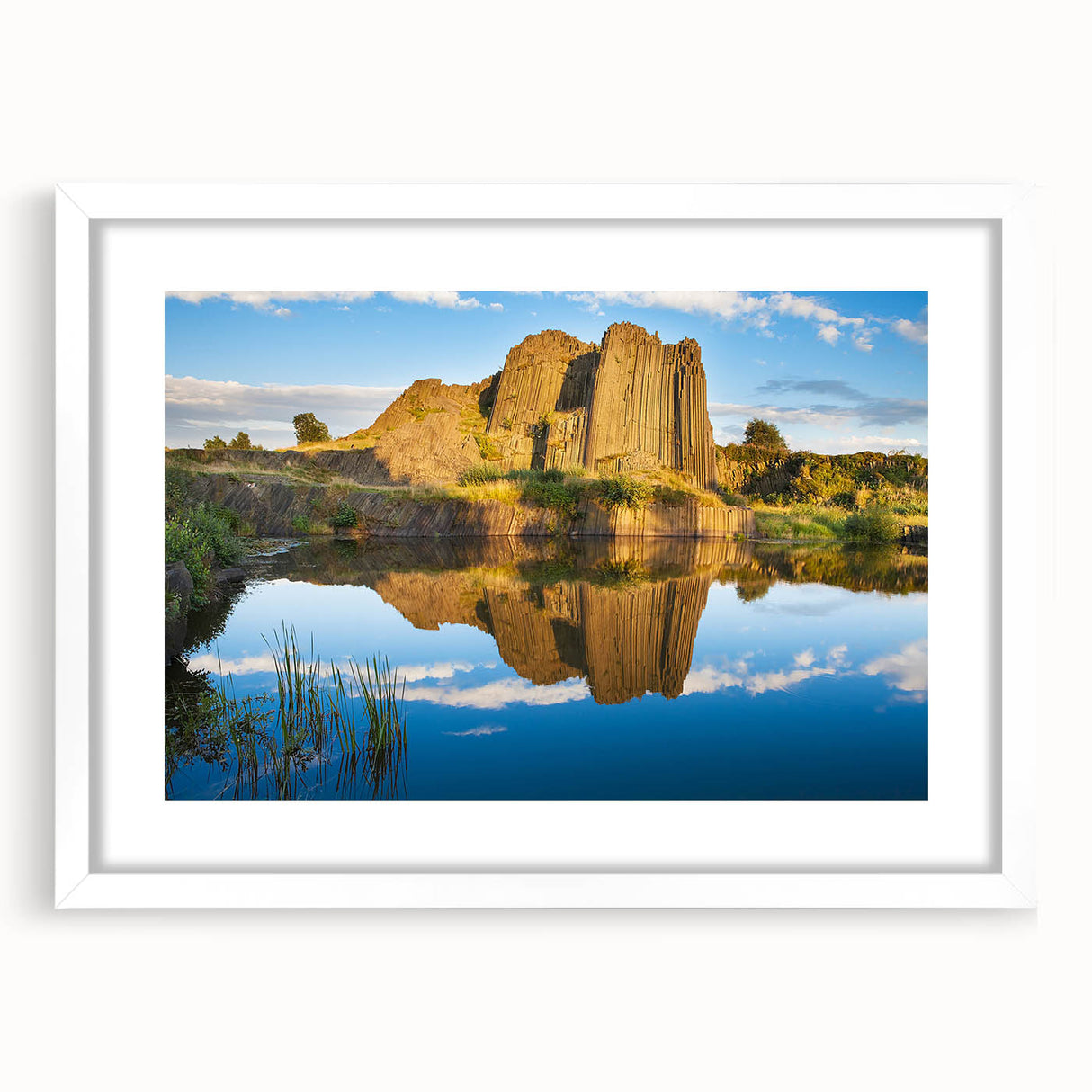 Textured art depicting a muted abstract representation of a European cityscape in a white framed mat, ideal for bedroom art.