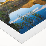 Art deco poster of a European cityscape in muted blue and tan tones on a rolled canvas, suitable for dining room wall art.