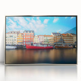 Large art print of a serene Danish landscape in muted greens and blues, framed in silver acrylic.