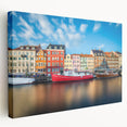 Large stretched canvas depicting a serene European town scene in soft pastel tones, suitable for kitchen wall art.