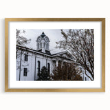 Abstract art print of Oxford scenery in muted earth tones on a framed canvas, suitable for dining room decor.
