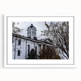 Textured art print of Oxford scenery in abstract style, muted earth tones, framed with white mat.