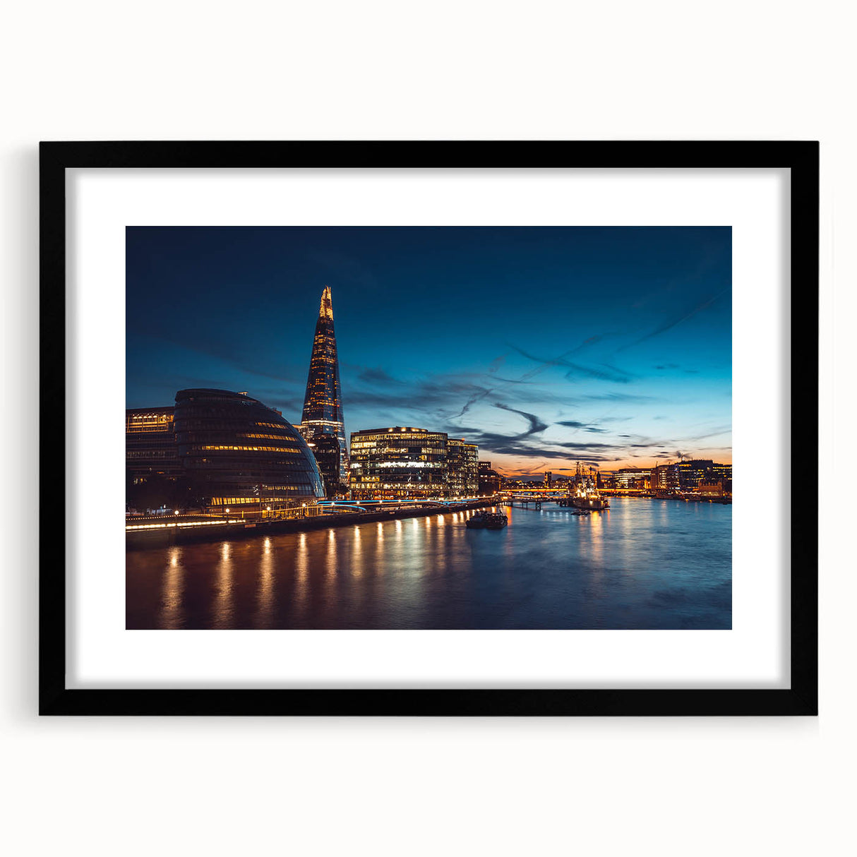Extra large abstract art print of the Thames River in vibrant colors on a textured canvas, framed in black.