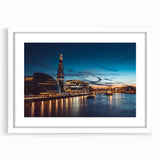 Textured abstract art print of the Thames River, in muted blue and gray tones, framed with a white mat.