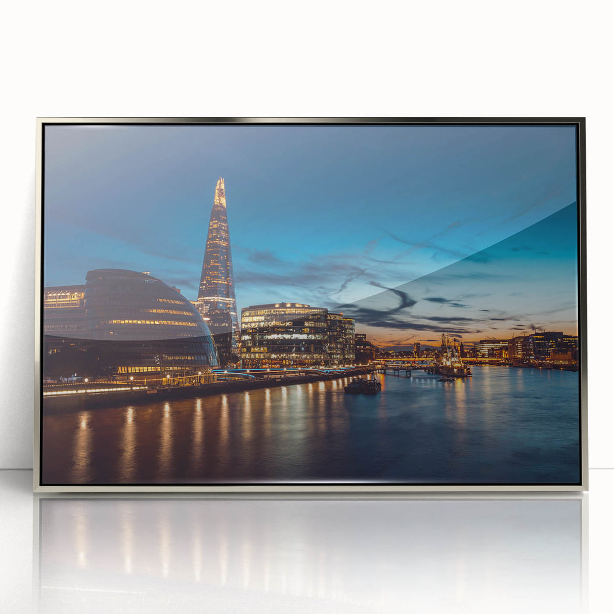 Large acrylic print of the Thames River in England with muted blue and gray tones, in a silver frame.