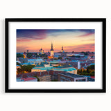 Abstract art print depicting vibrant, colorful textured scenery, framed with a black mat, ideal for living room decor.