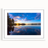 Textured abstract art print of a serene Finnish landscape in muted blue and gray tones, framed with a white mat.