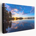 Scenic landscape of a Finnish lake at sunset on stretched canvas, featuring cool blue and gray tones.
