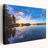 Scenic landscape of a Finnish lake at sunset on stretched canvas, featuring cool blue and gray tones.