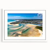 Textured abstract art print of a European scenery in muted earth tones, framed in white, suitable for bedroom decor.