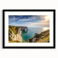 Extra large abstract art print depicting a colorful, textured scene of Normandy, France, in a black frame with mat.