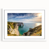 Textured abstract art print of Normandy scenery in muted earth tones, framed with a white mat, ideal for bedroom wall decor.