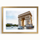 Abstract art print of Paris scenery in muted gold and blue tones, framed with a gold mat, suitable for dining room decor.