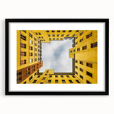 Abstract art print of Berlin's cityscape in vibrant colors on a large framed canvas, suitable for living room decor.